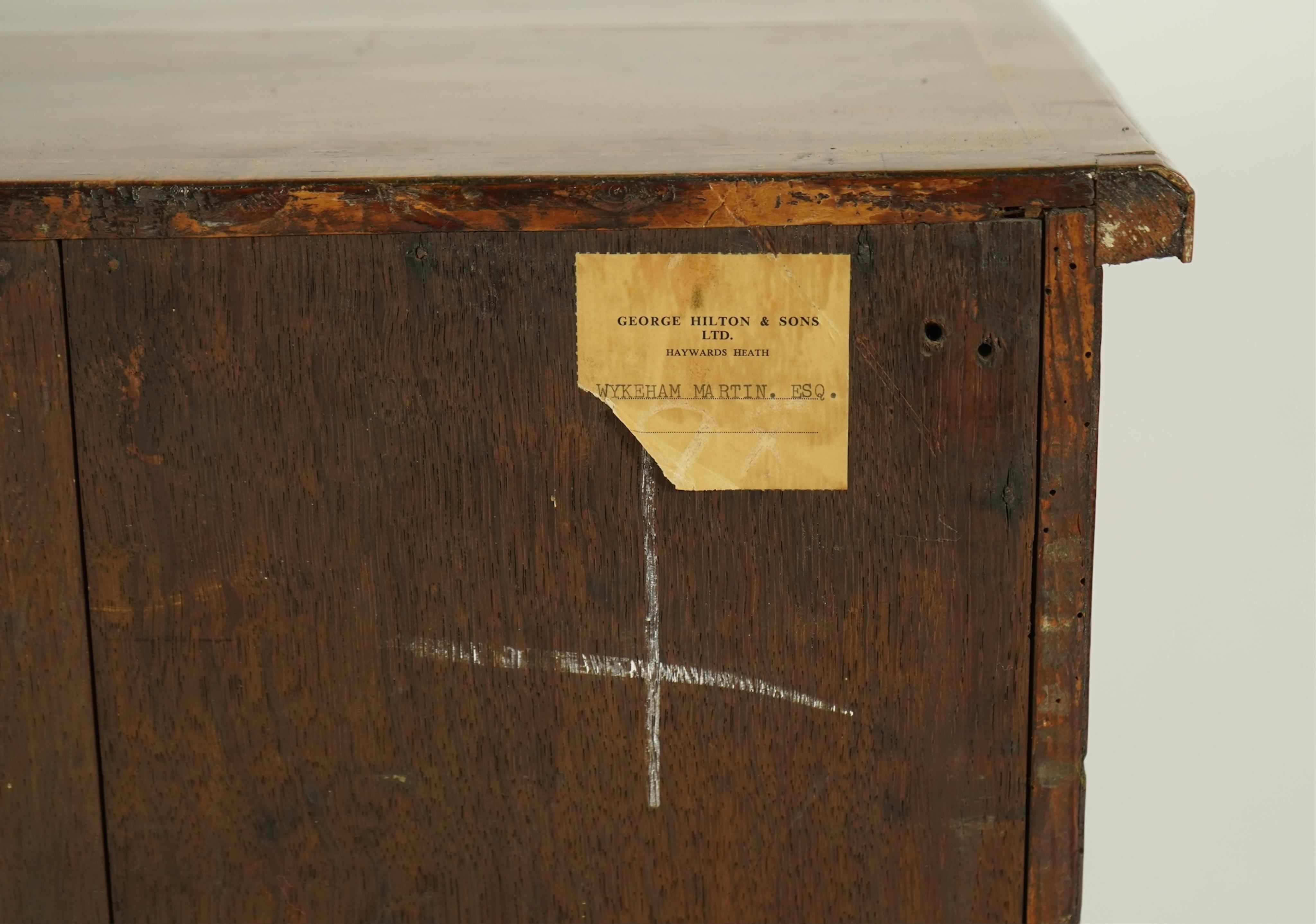 A small early 18th century and later cross and feather banded walnut veneered chest